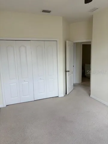 a bathroom with a double vanity sink and mirror