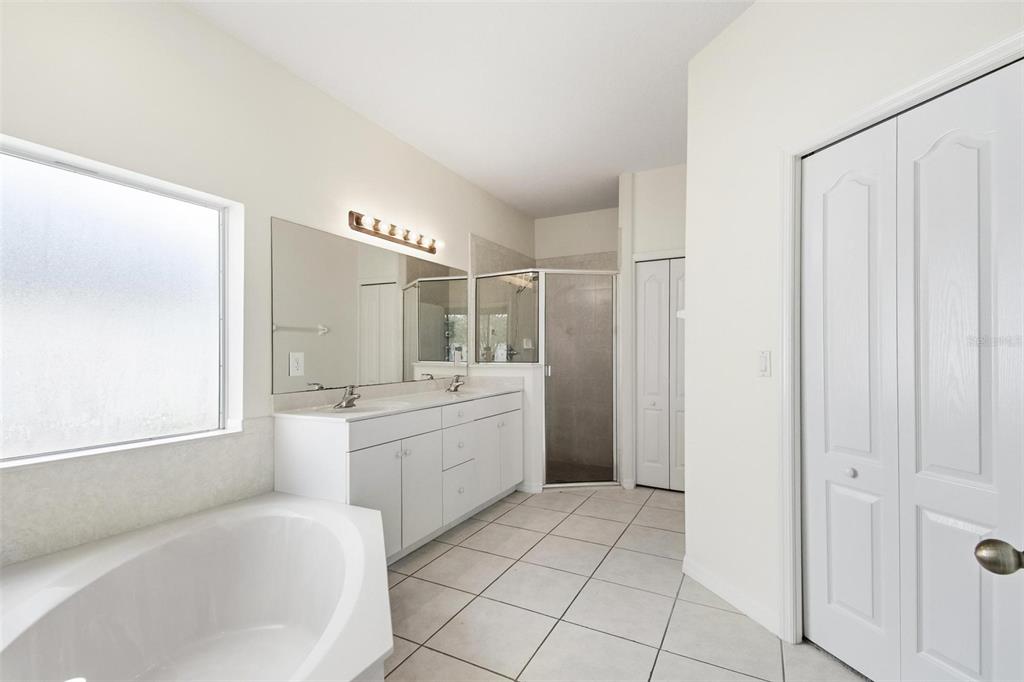 29 East Diamond Drive Palm Coast, FL 32164 - Photo 38 of 55 a large bathroom with a bathtub and a sink