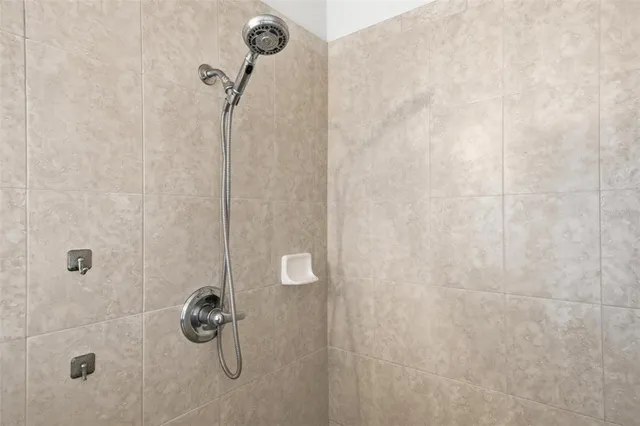 a bathroom with a sink toilet and a mirror