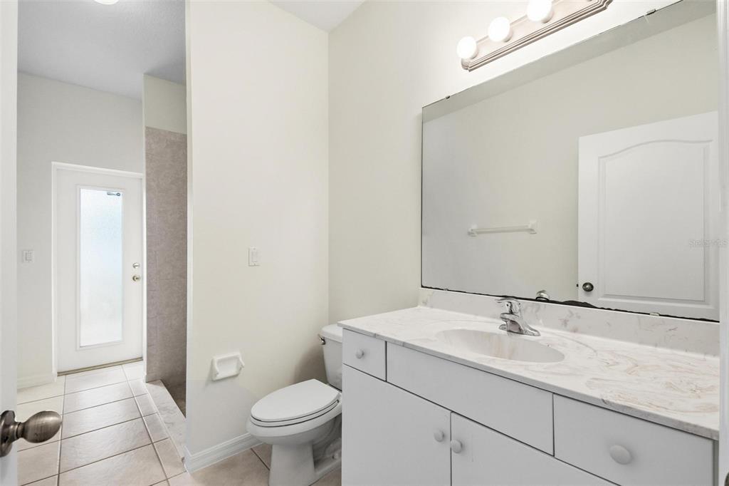 29 East Diamond Drive Palm Coast, FL 32164 - Photo 45 of 55 a bathroom with a sink toilet and a mirror