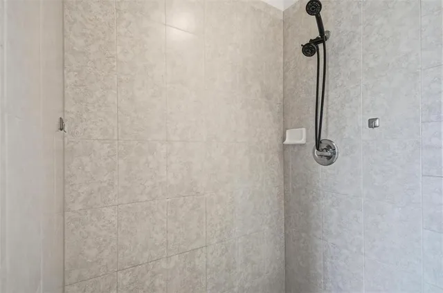 a view of a big room with windows and entryway