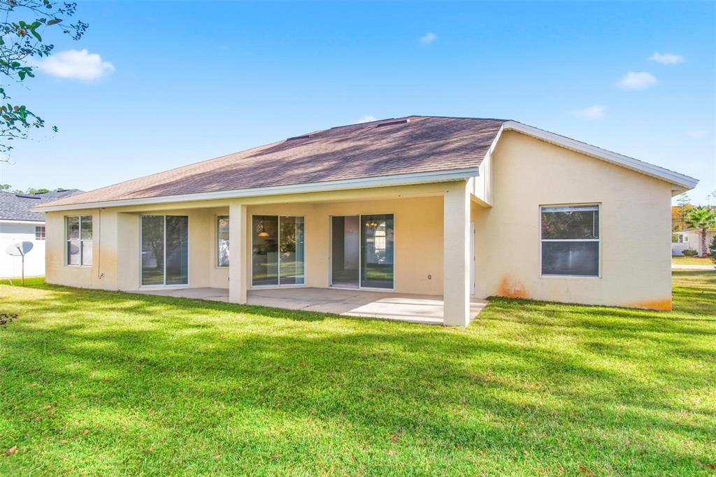 29 East Diamond Drive Palm Coast, FL 32164 - Photo 53 of 55 a view of a house with a garden