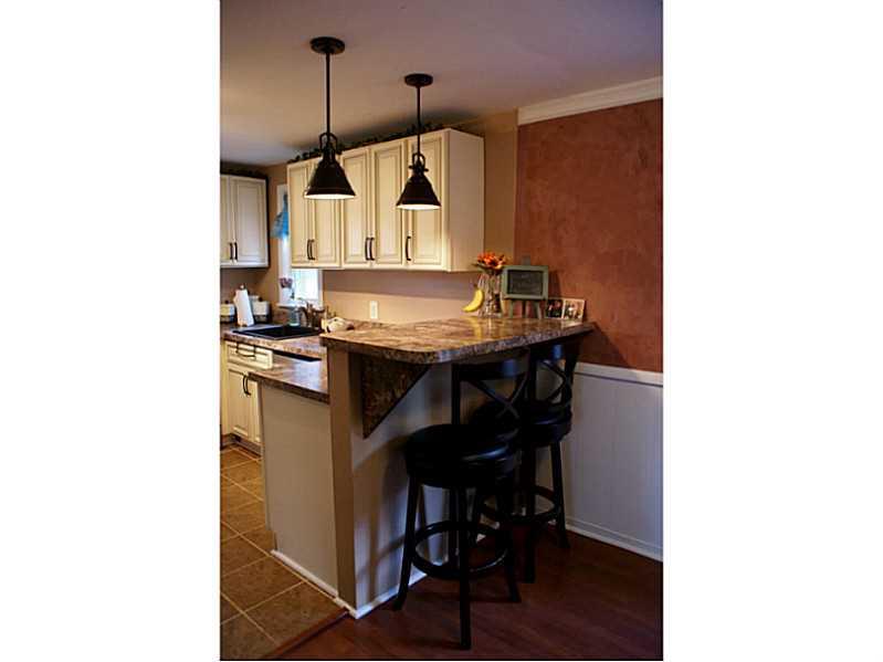 860 Middle Road Pittsburgh, PA 15234 - Photo 5 of 22 Breakfast bar separating kitchen and dining area