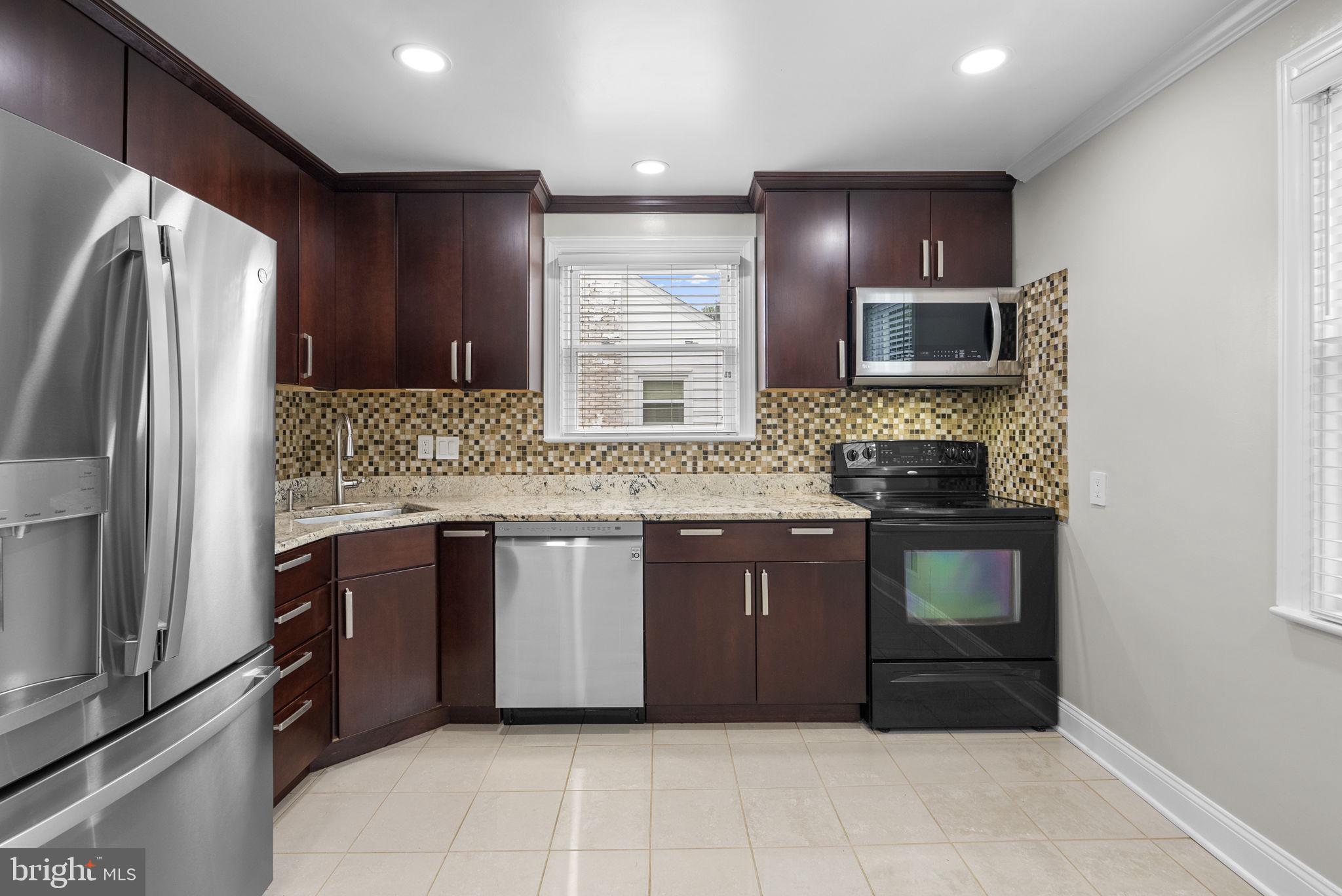 3013 Medway Street Silver Spring, MD 20902 - Photo 5 of 30 Modern kitchen with sleek finishes.