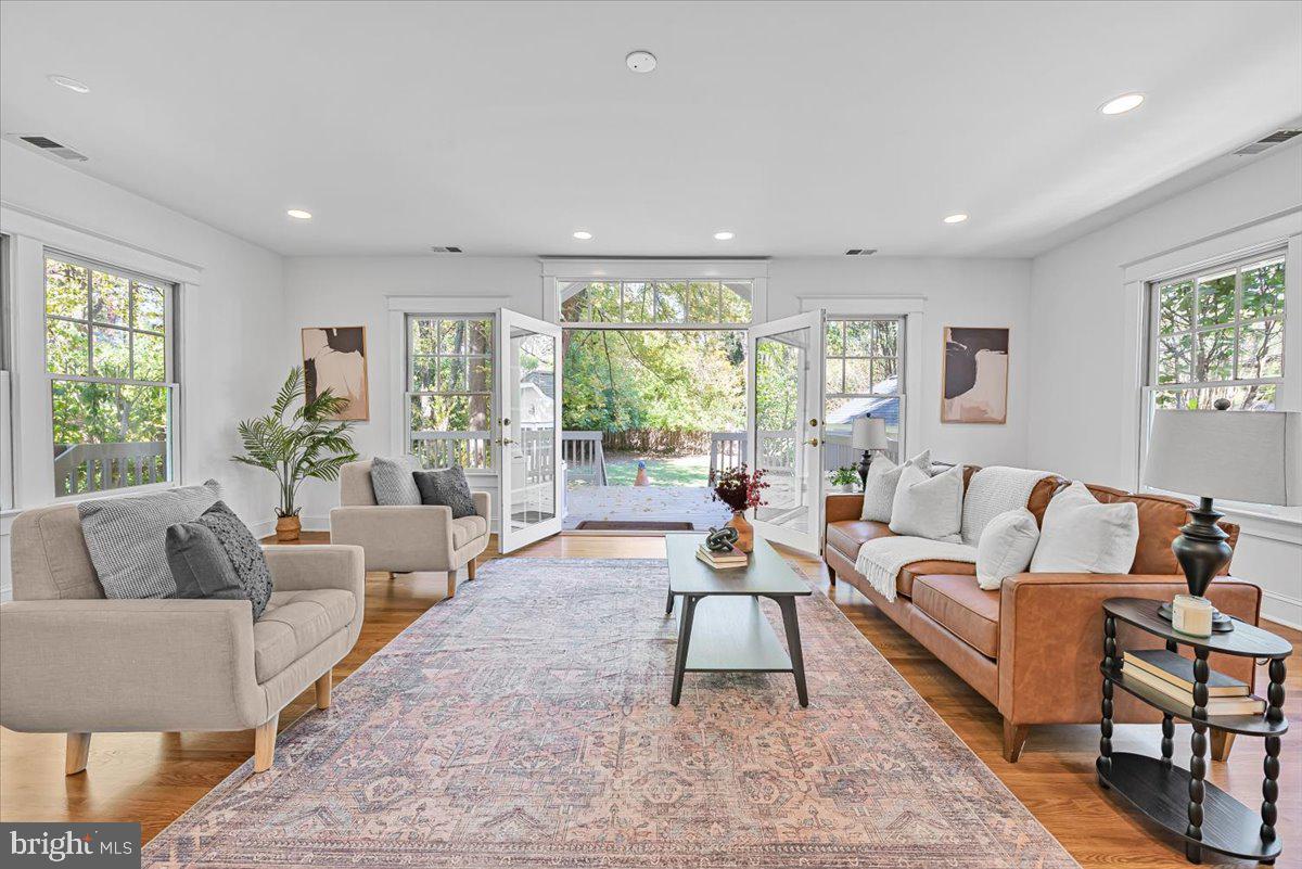 4937 Brandywine Street Northwest Washington, DC 20016 - Photo 1 of 53 a living room with furniture and a large window
