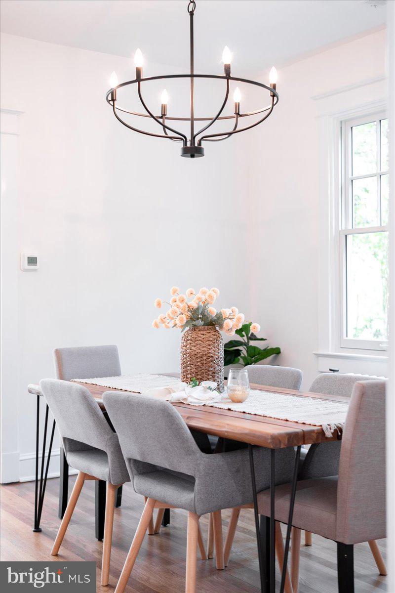 4937 Brandywine Street Northwest Washington, DC 20016 - Photo 11 of 53 a view of a dining room that has a table and chairs