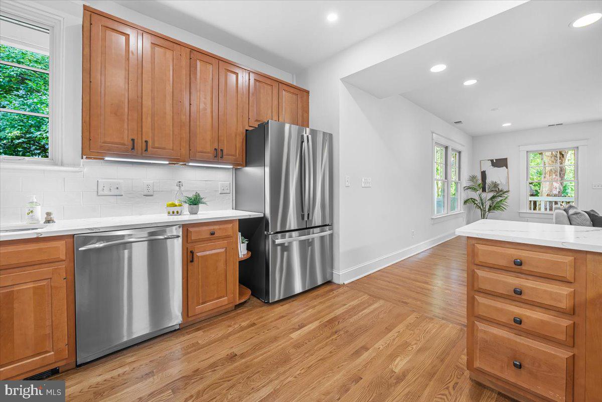 4937 Brandywine Street Northwest Washington, DC 20016 - Photo 13 of 53 a kitchen with a refrigerator sink and cabinets