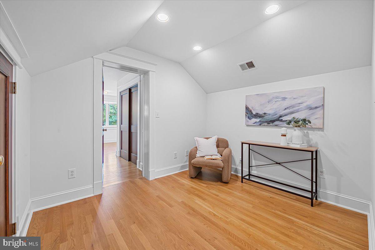 4937 Brandywine Street Northwest Washington, DC 20016 - Photo 27 of 53 a bedroom with a bed and a painting on the wall