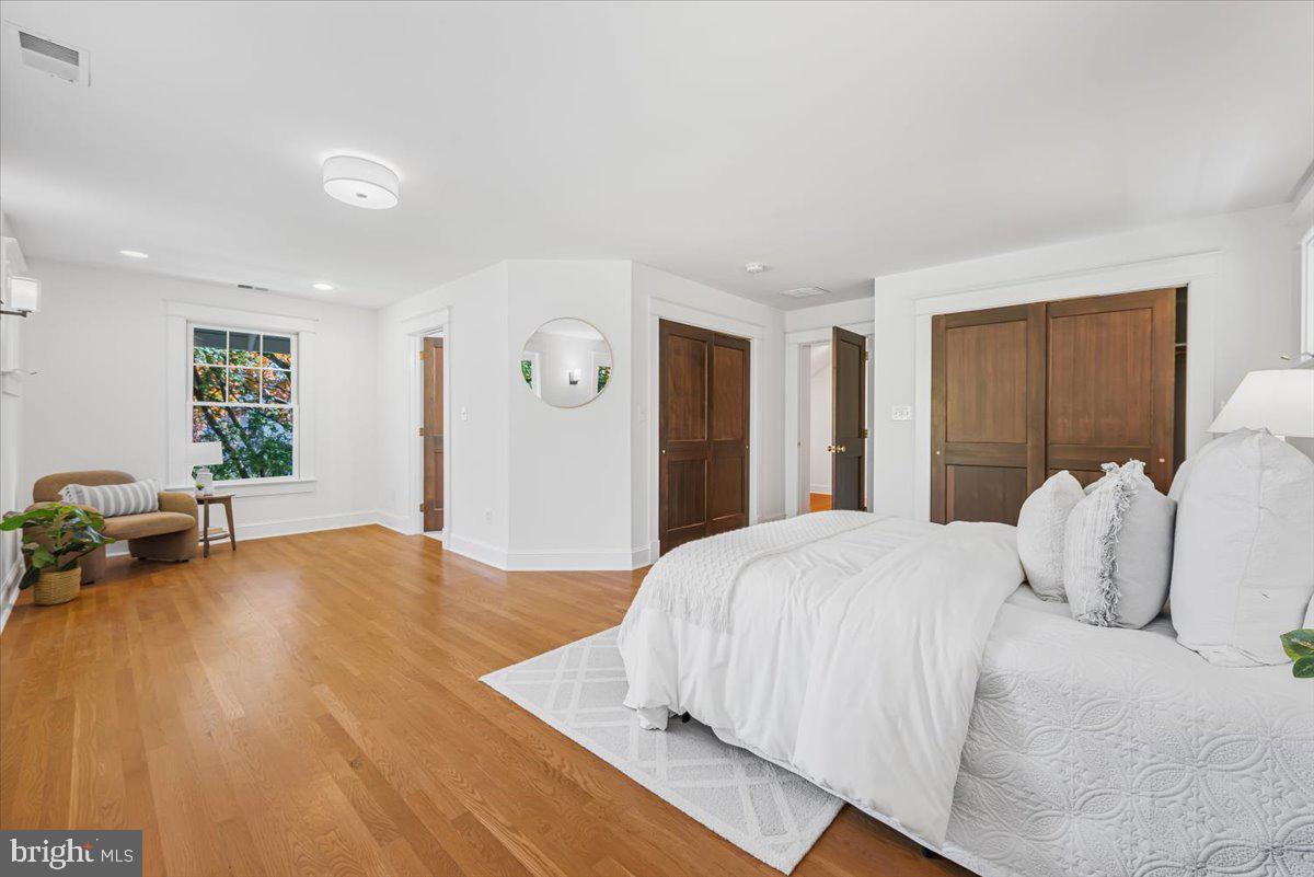 4937 Brandywine Street Northwest Washington, DC 20016 - Photo 29 of 53 a bedroom with a large bed and a large window