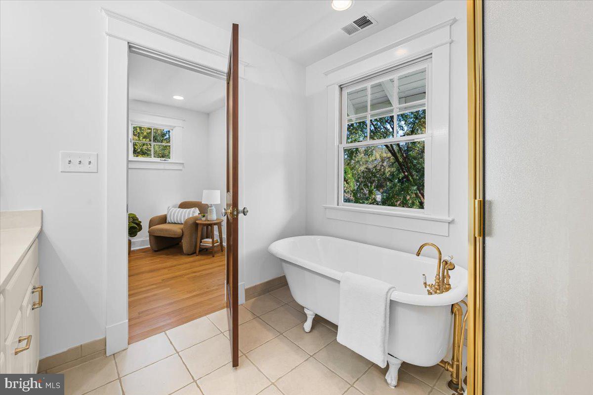 4937 Brandywine Street Northwest Washington, DC 20016 - Photo 32 of 53 a spacious bathroom with a bathtub and next to a window