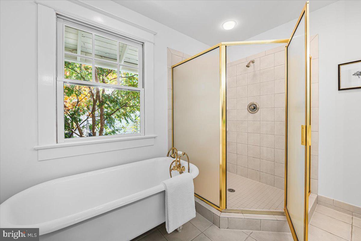 4937 Brandywine Street Northwest Washington, DC 20016 - Photo 34 of 53 a bathroom with a bathtub and a shower
