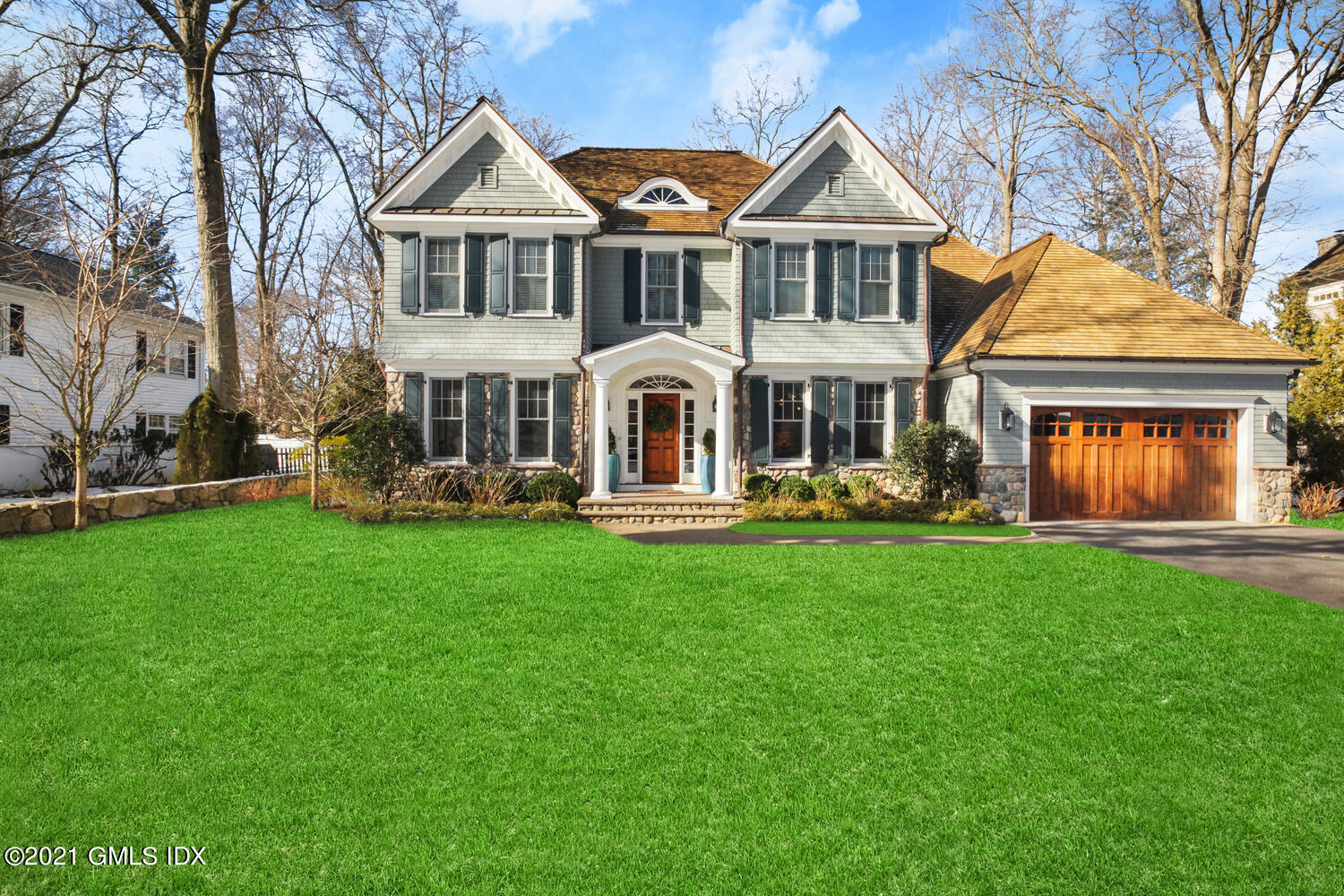 22 Bramble Lane Riverside, CT 06878 - Photo 1 of 1 a front view of a house with a yard