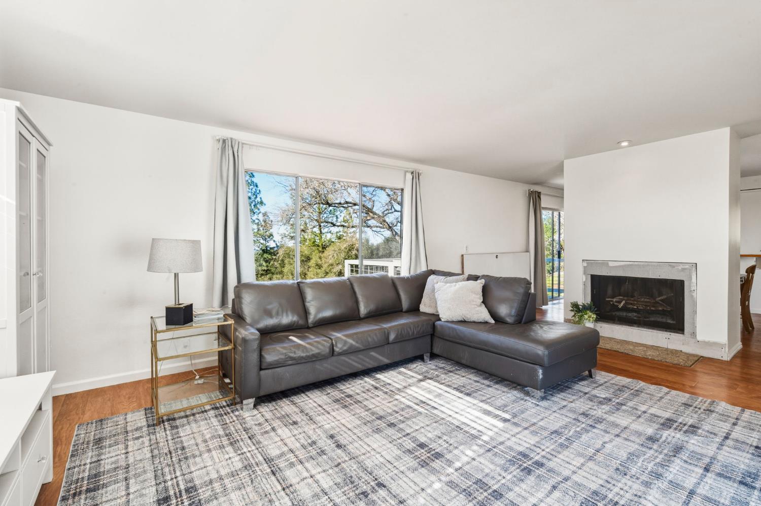 11172 North Ponderosa Way Rough and Ready, CA 95975 - Photo 12 of 47 a living room with furniture and a fireplace