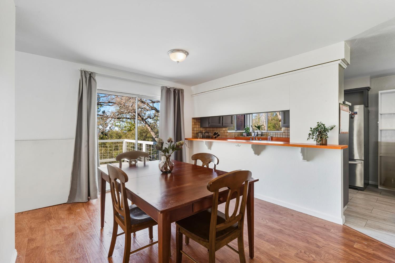 11172 North Ponderosa Way Rough and Ready, CA 95975 - Photo 13 of 47 a view of a dining room with furniture and wooden floor