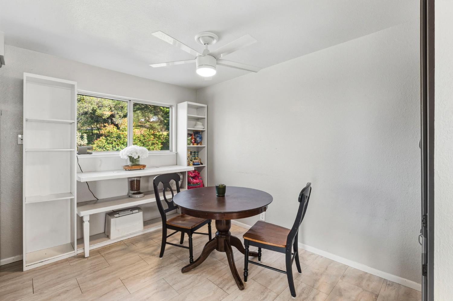 11172 North Ponderosa Way Rough and Ready, CA 95975 - Photo 19 of 47 a view of a dining room with furniture and a window