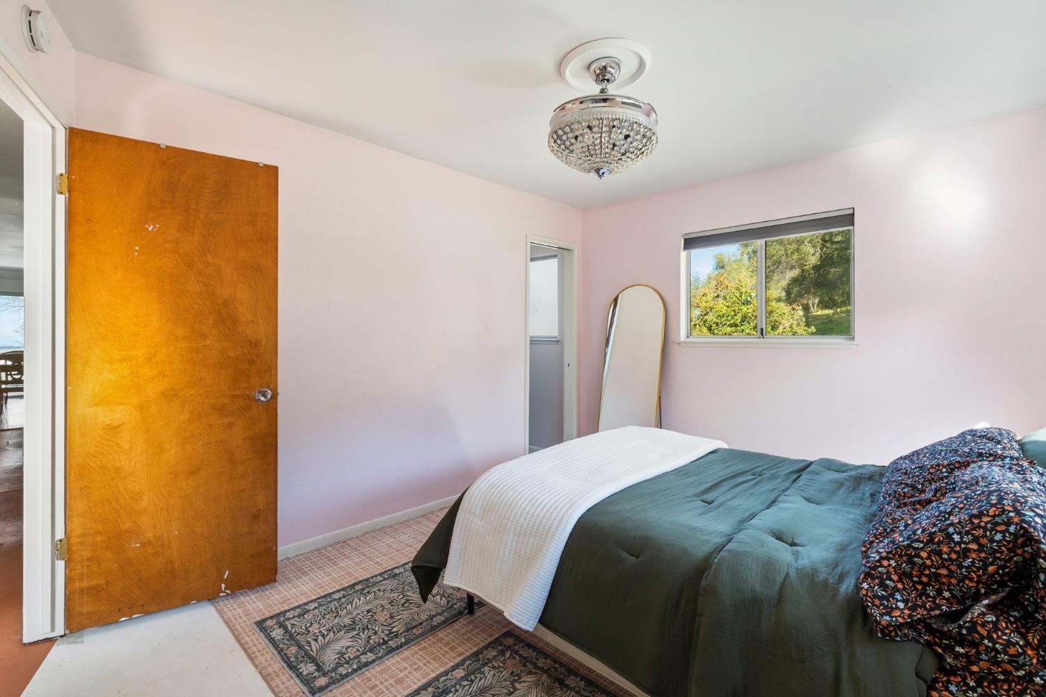 11172 North Ponderosa Way Rough and Ready, CA 95975 - Photo 21 of 47 a bedroom with a bed and a window