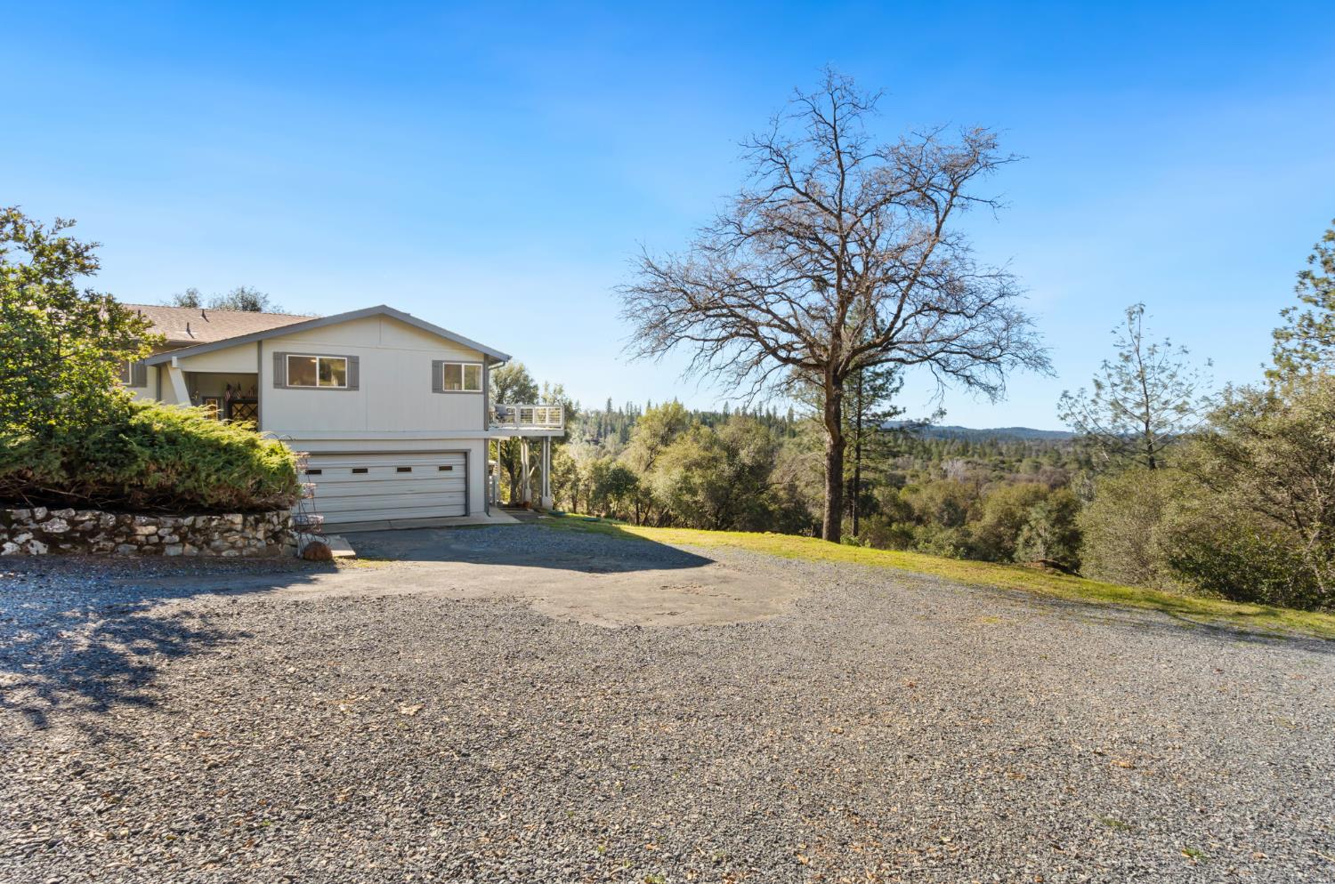 11172 North Ponderosa Way Rough and Ready, CA 95975 - Photo 3 of 47 a view of a house with a big yard and large trees