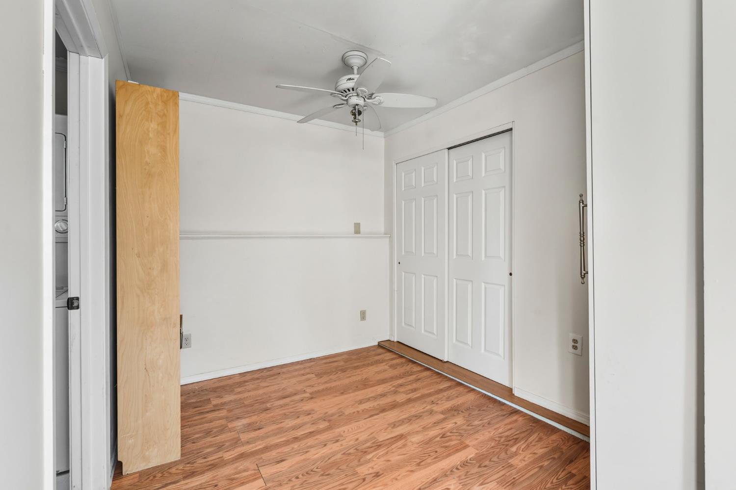 11172 North Ponderosa Way Rough and Ready, CA 95975 - Photo 37 of 47 a view of a room with wooden floor and a ceiling fan