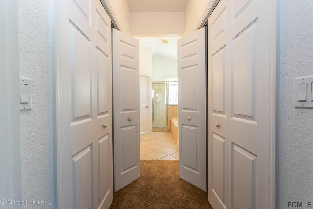 10 Eagle Place Palm Coast, FL 32164 - Photo 22 of 34 Entry to bath - closets on each side