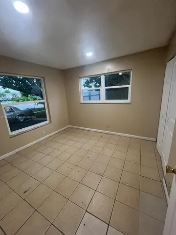 a view of an empty room and window