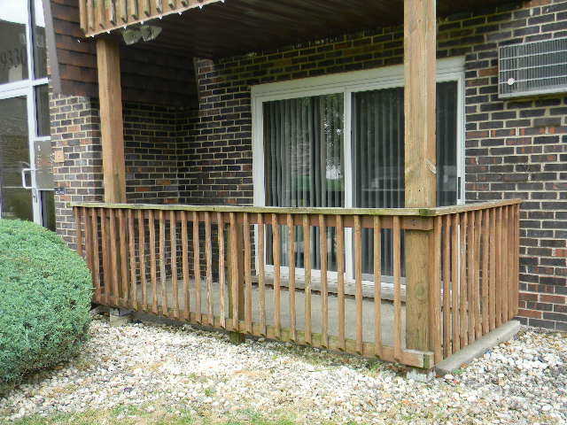 19330 Wolf Road, Unit 1 Mokena, IL 60448 - Photo 18 of 18 a view of a house with a small yard and wooden fence