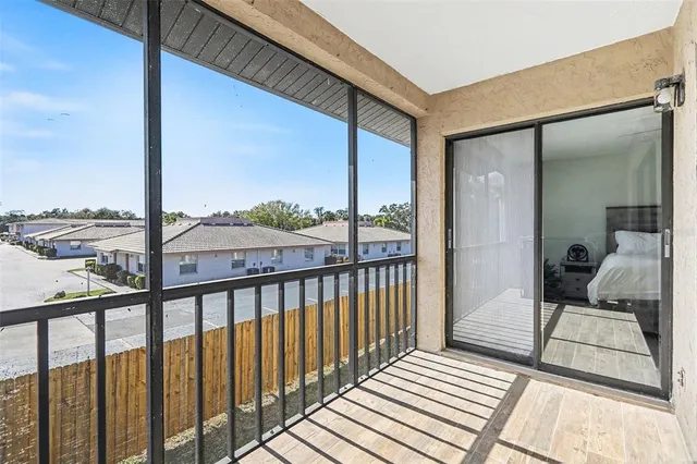 a view of a balcony with furniture