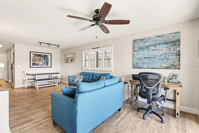 a living room with furniture and a window