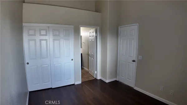 a view of room with wooden floor