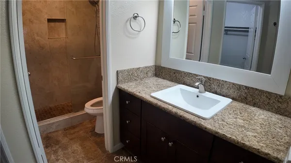 a view of a street with houses on both side