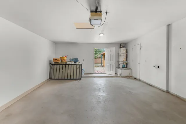 a backyard of a house with flower plants