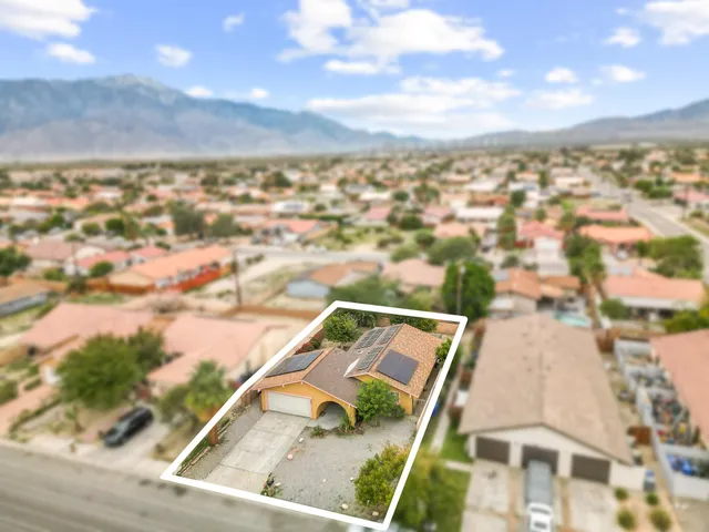 an aerial view of residential house with outdoor space