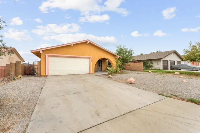 a front view of a house with yard