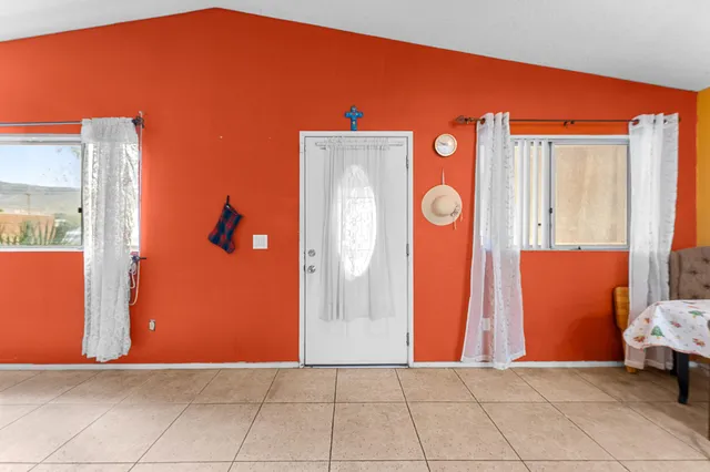 a view of front door with yard