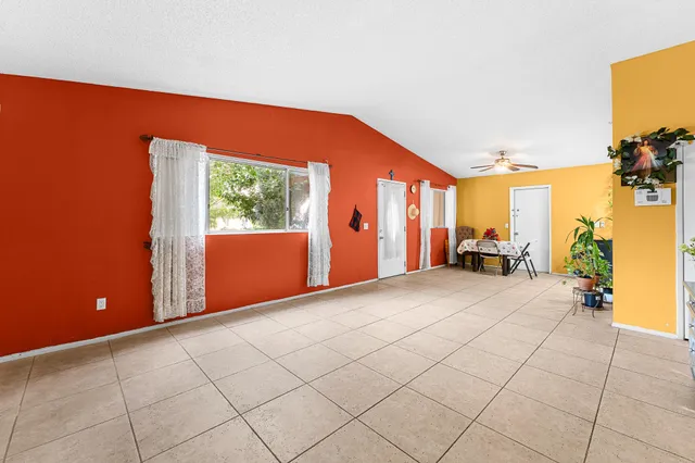 a view of a livingroom with furniture and a window
