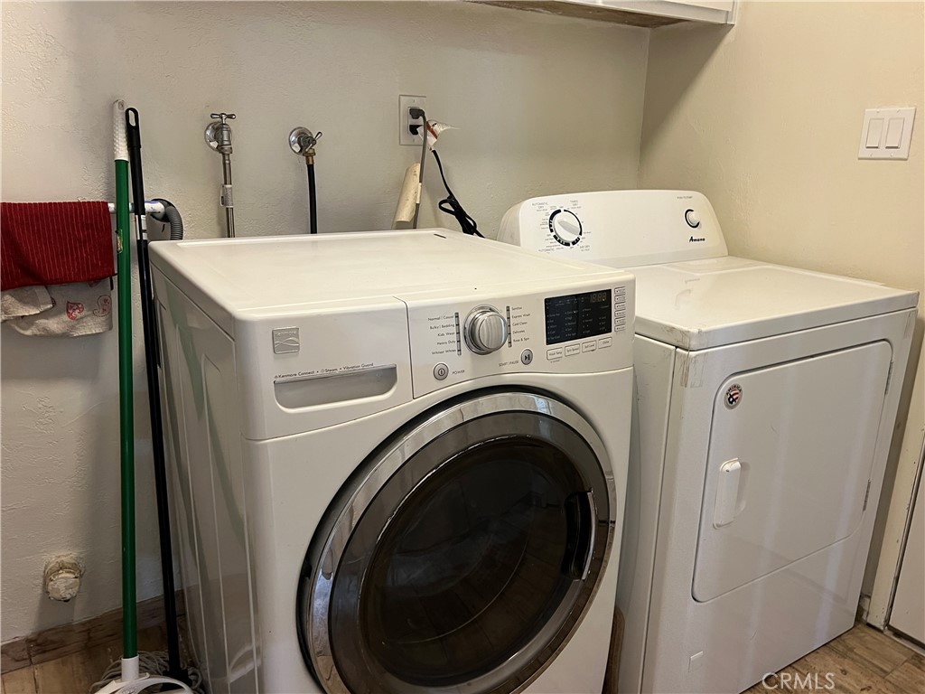 22903 Waters Crestline, CA 92325 - Photo 11 of 22 a utility room with dryer and washer