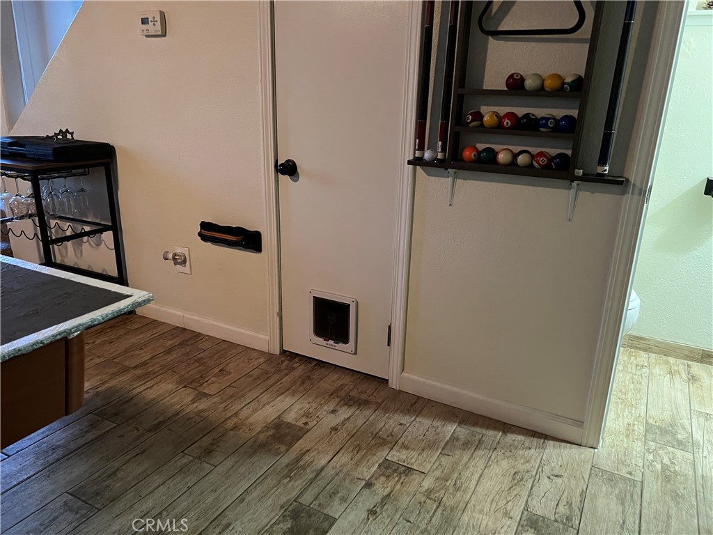 22903 Waters Crestline, CA 92325 - Photo 14 of 22 a view of a refrigerator in kitchen and wooden floor