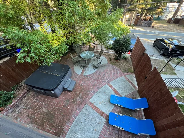 a view of a patio with couches chairs and a potted plant