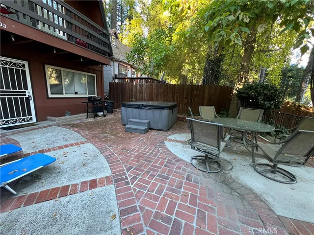 a view of backyard with a table and chairs