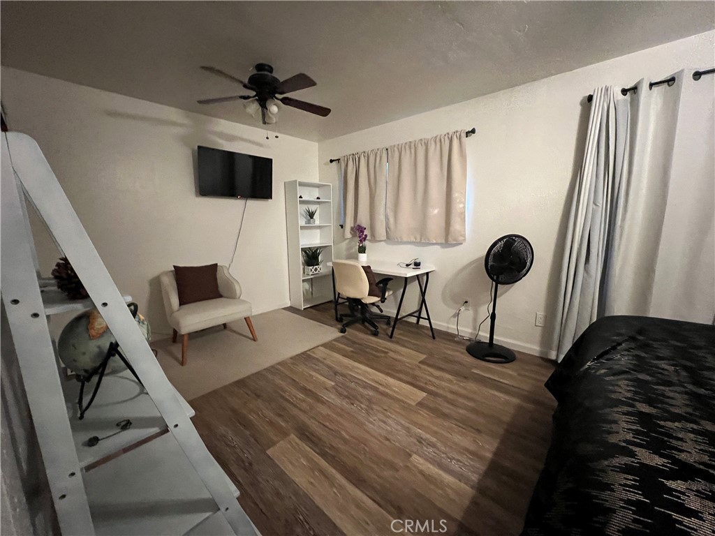 22903 Waters Crestline, CA 92325 - Photo 21 of 22 a living room with furniture and a flat screen tv
