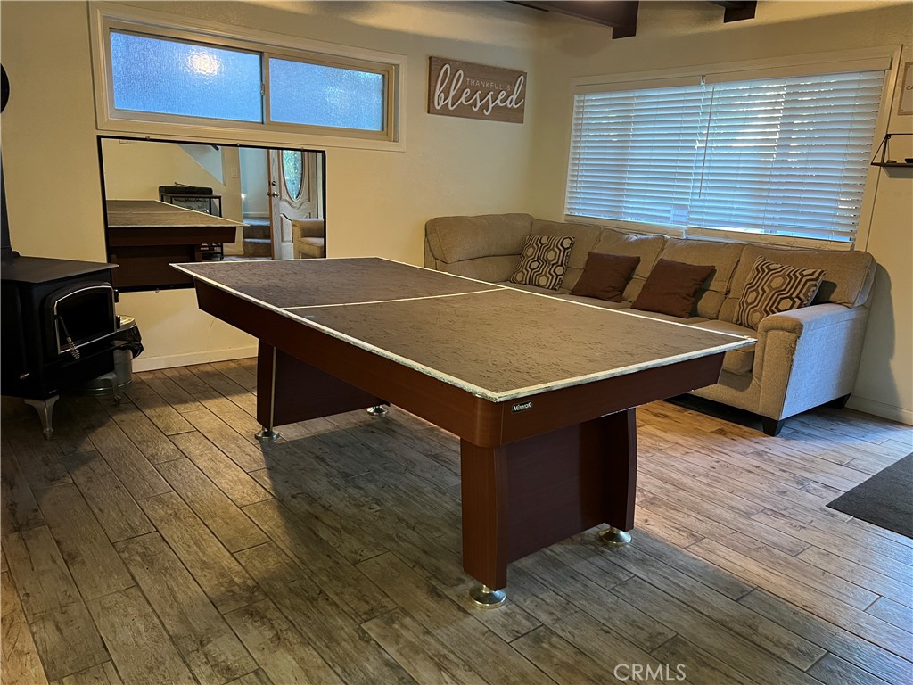 22903 Waters Crestline, CA 92325 - Photo 3 of 22 a room with wooden floor and furniture