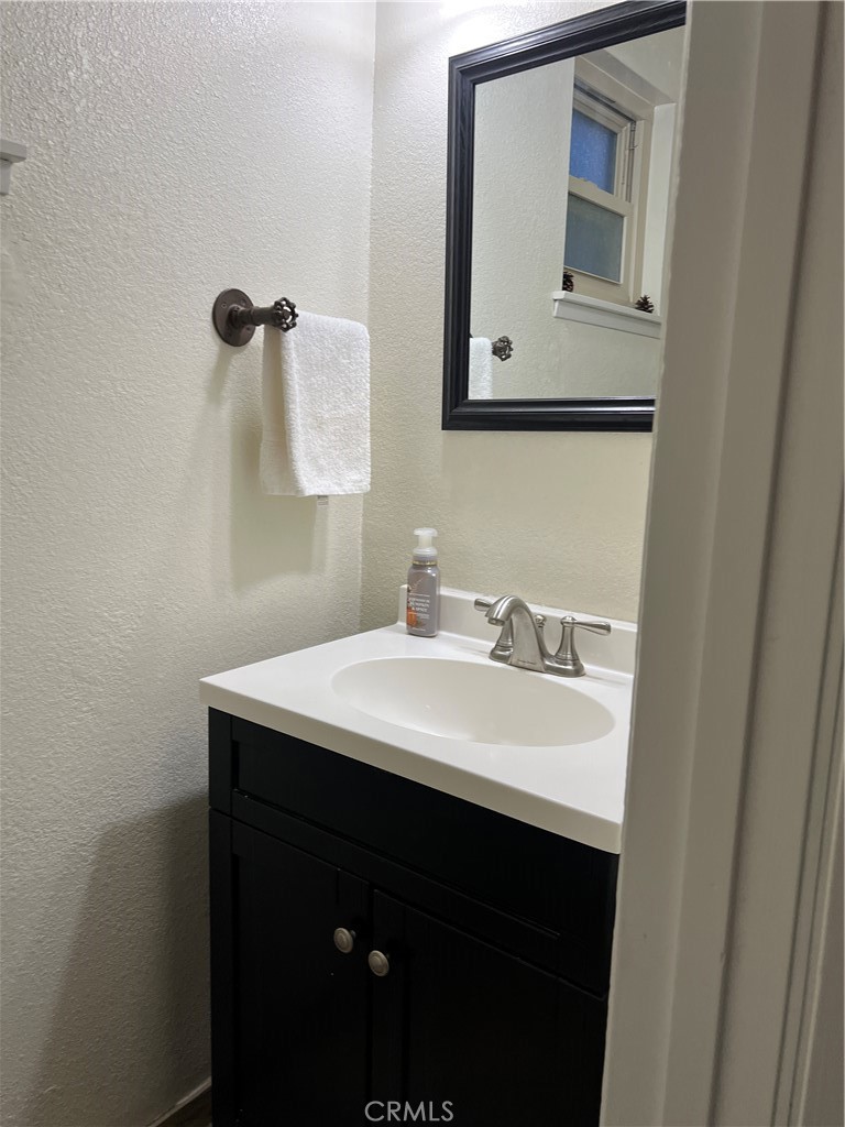 22903 Waters Crestline, CA 92325 - Photo 6 of 22 a bathroom with a sink and a mirror