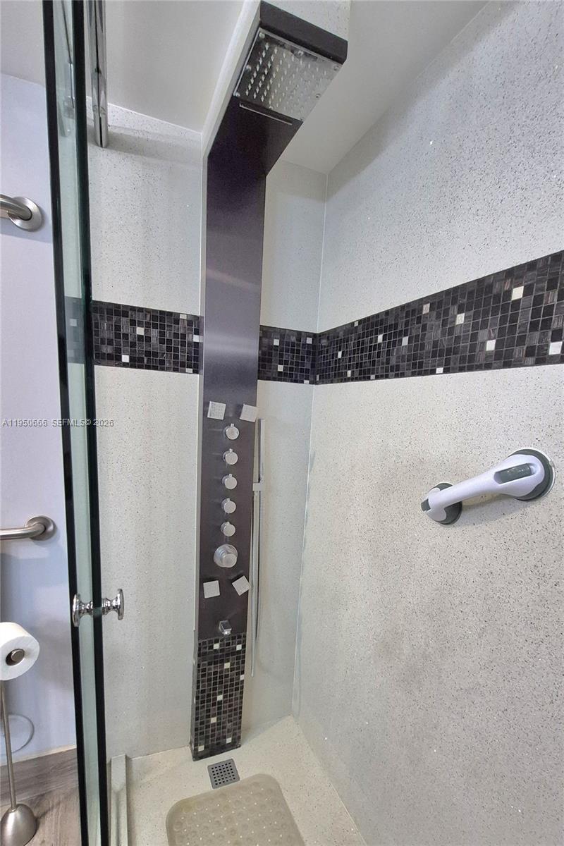 3854 Lyons Road, Unit 1025 Coconut Creek, FL 33073 - Photo 14 of 30 a bathroom with a shower