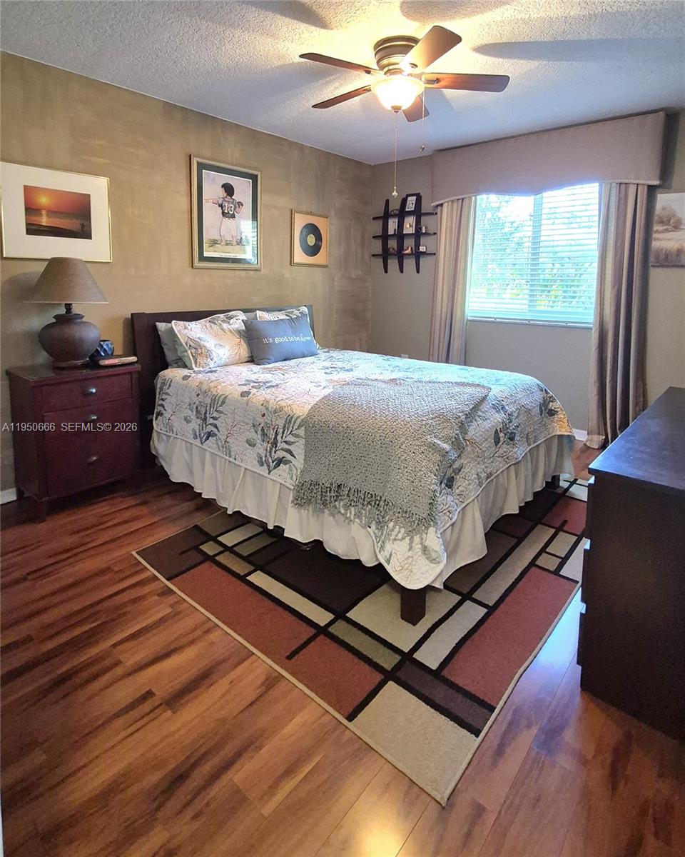 3854 Lyons Road, Unit 1025 Coconut Creek, FL 33073 - Photo 19 of 30 a bedroom with bed and window