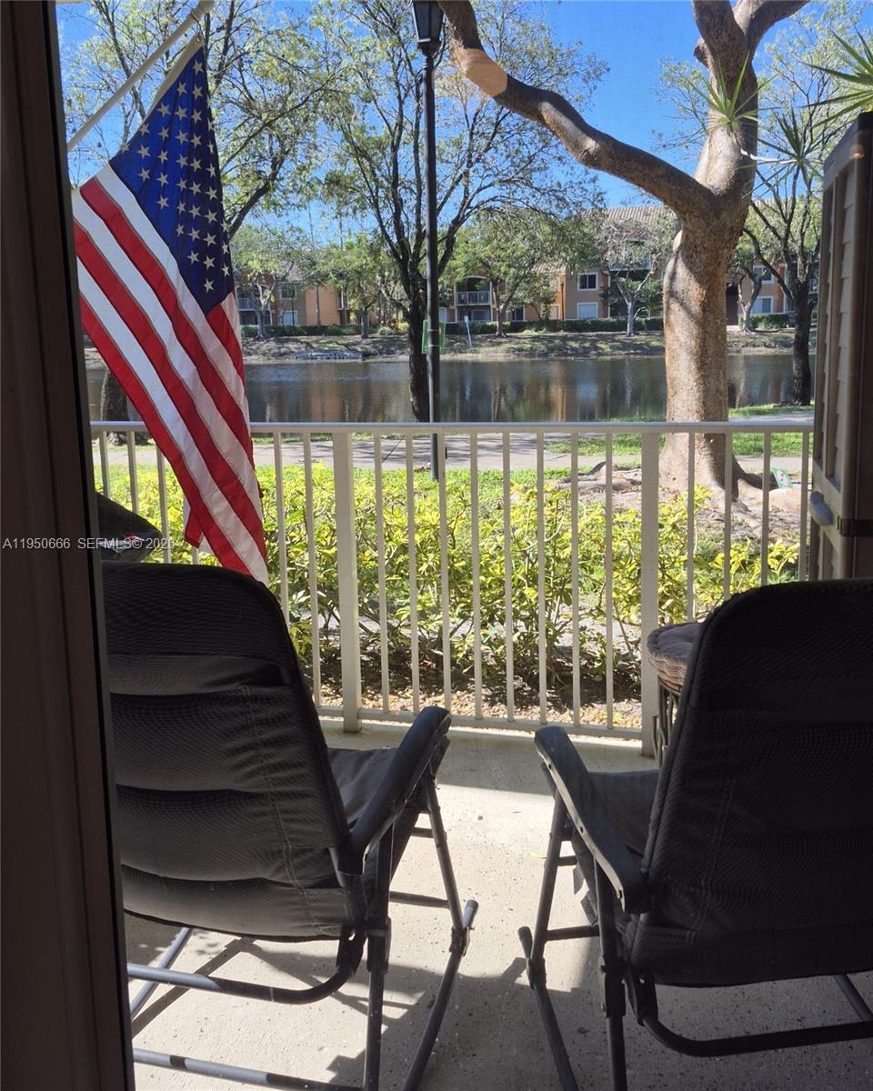 3854 Lyons Road, Unit 1025 Coconut Creek, FL 33073 - Photo 21 of 30 a view of a living room filled with furniture