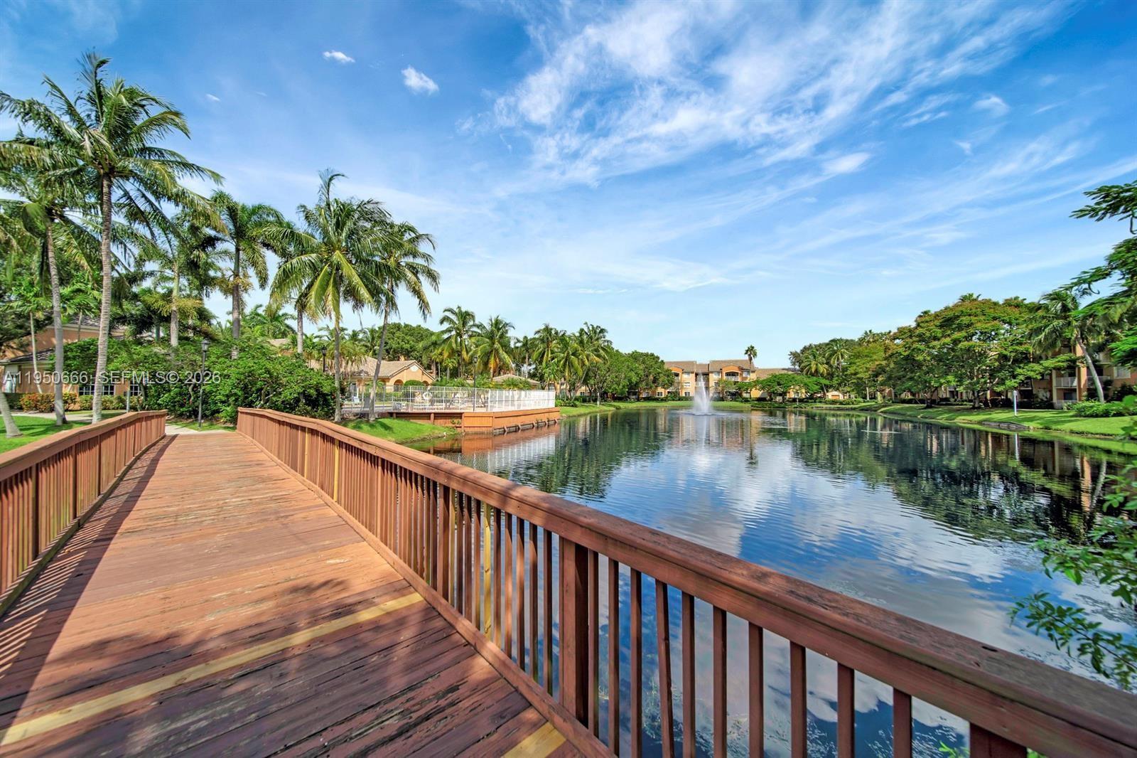 3854 Lyons Road, Unit 1025 Coconut Creek, FL 33073 - Photo 29 of 30 a view of balcony and yard