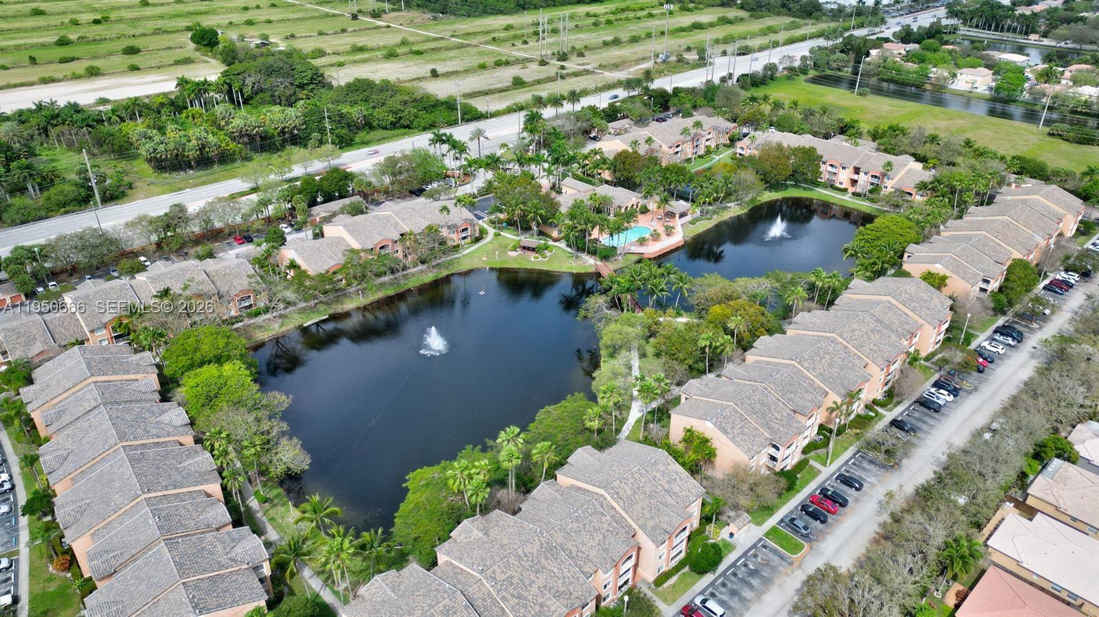 3854 Lyons Road, Unit 1025 Coconut Creek, FL 33073 - Photo 30 of 30 an aerial view of a house with a yard