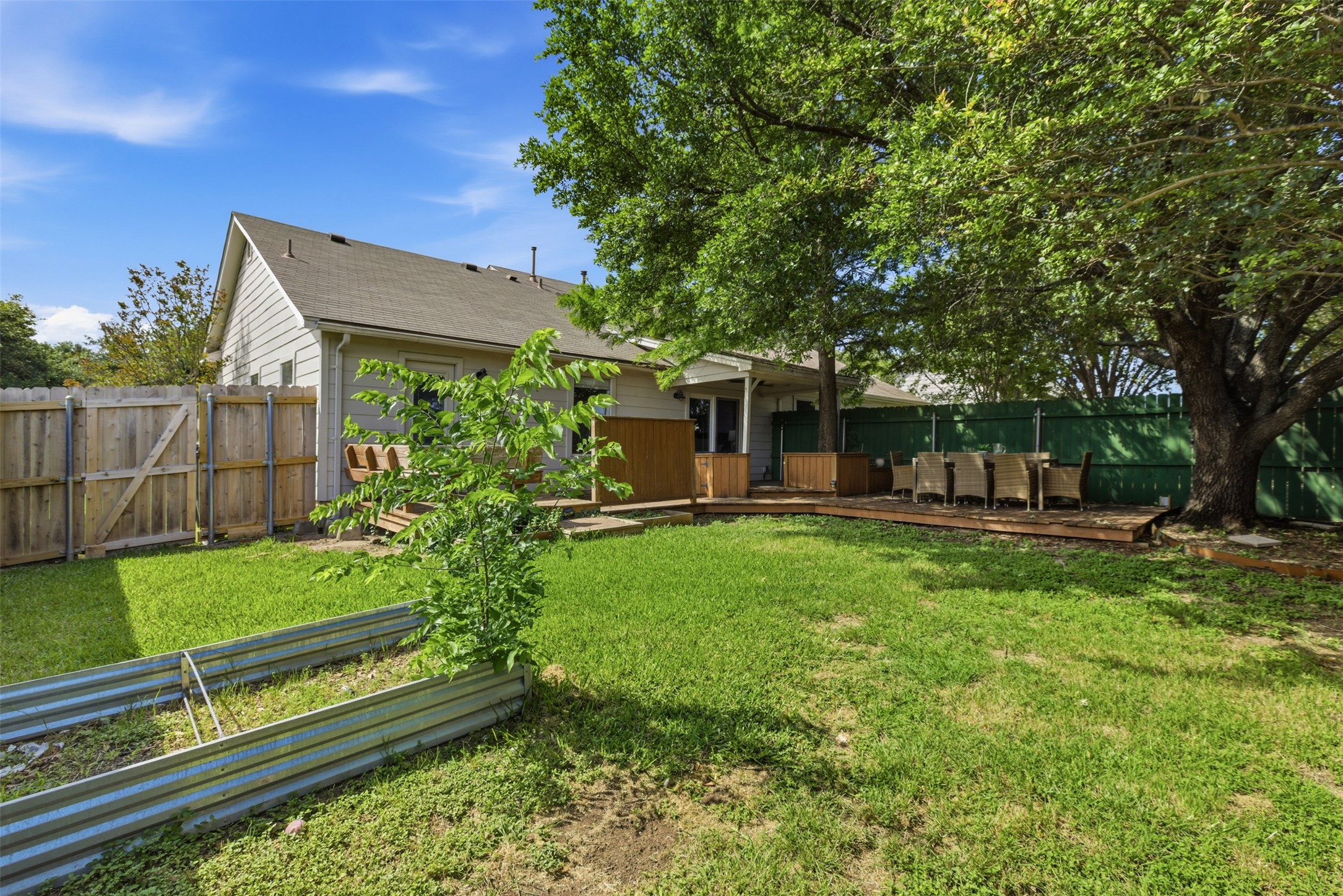 112 Prairie Springs Loop Georgetown, TX 78626 - Photo 20 of 23 a view of a house with backyard and a tree