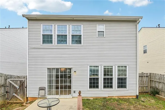 a front view of a house with a large window