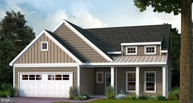 a view of a house with a yard and potted plants
