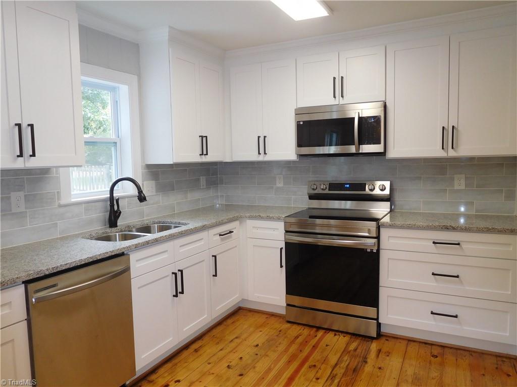 2126 Polo Road Winston-Salem, NC 27106 - Photo 10 of 33 All NEW: shaker cabinets, granite counters, tile backsplash & all new appliances.